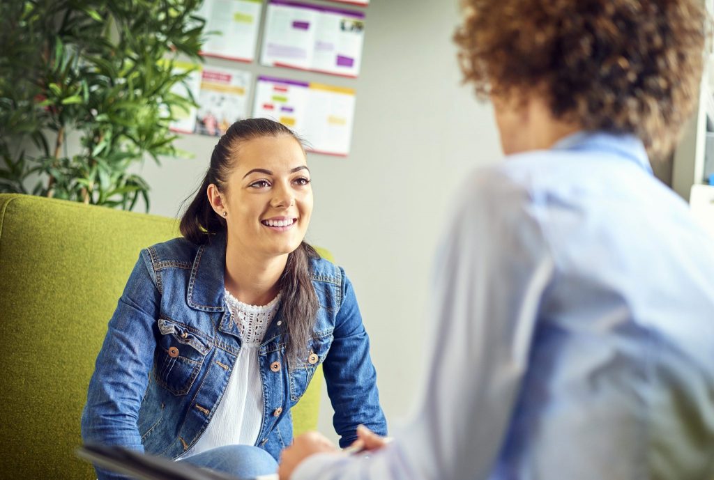 Woman talking to a counselor.