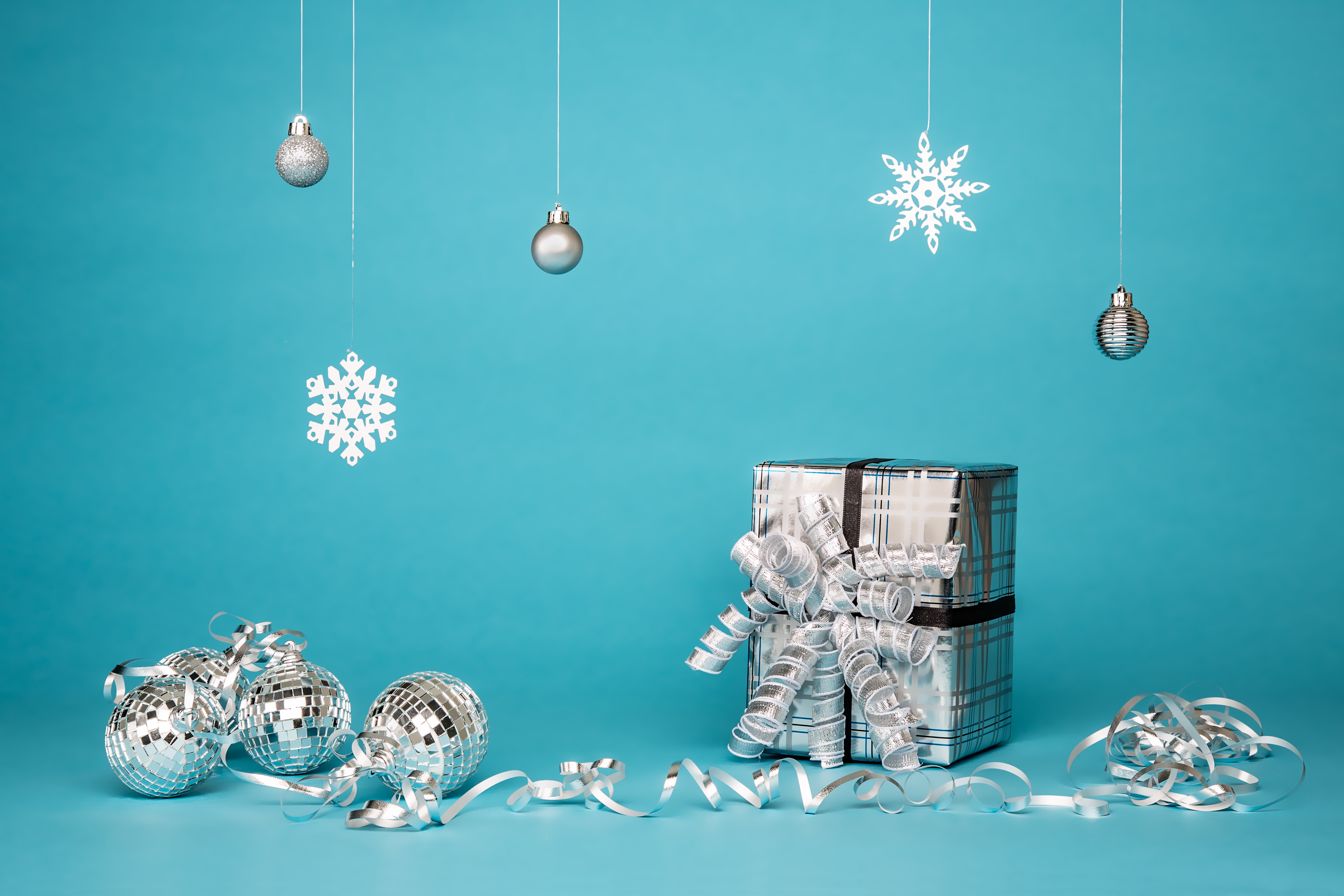 White gifts & balls on blue background